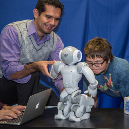 An interdisciplinary faculty-student-robot research team based out of the Daniel Felix Ritchie School of Engineering and Computer Science is conducting a pilot study exploring whether humanoid robots like NAO can improve social and communication skills in children with autism spectrum disorders. Photo: Wayne Armstrong