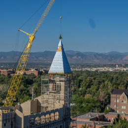 23,000-pound spire placed atop new international relations building